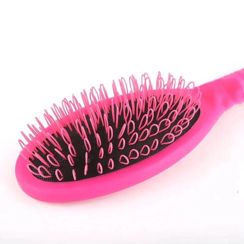 Plastic airbag comb with ring teeth for hair extensions in black or pink colour