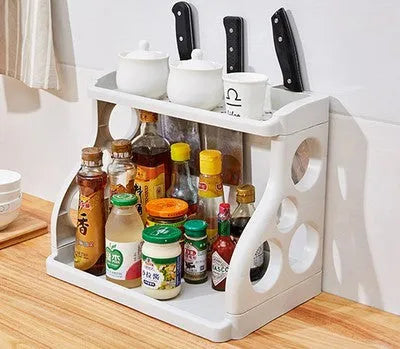 Foldable kitchen storage rack with multilayer shelves in white colour on countertop