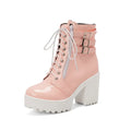 Women's black thick-heeled ankle boots with lace-up front and round toe on a waterproof platform