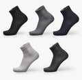 Men's bamboo fibre business socks in grey with a small-square pattern, shown on a foot.