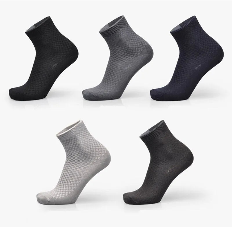 Men's bamboo fibre business socks in grey with a small-square pattern, shown on a foot.