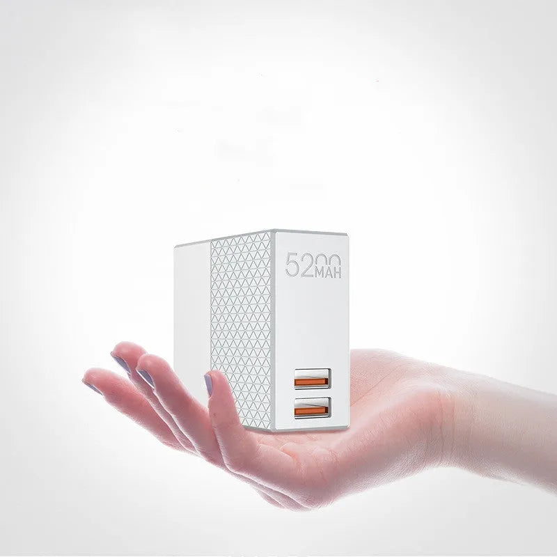 White mobile power bank charger with integrated plug showing UK, US and EU plug options