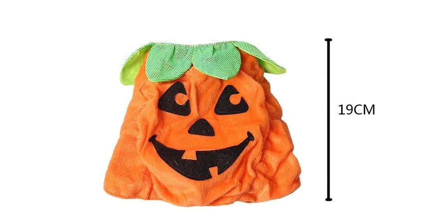 Yellow pumpkin Halloween pet costume with green leaf decoration on a cat wearing the hat and dress