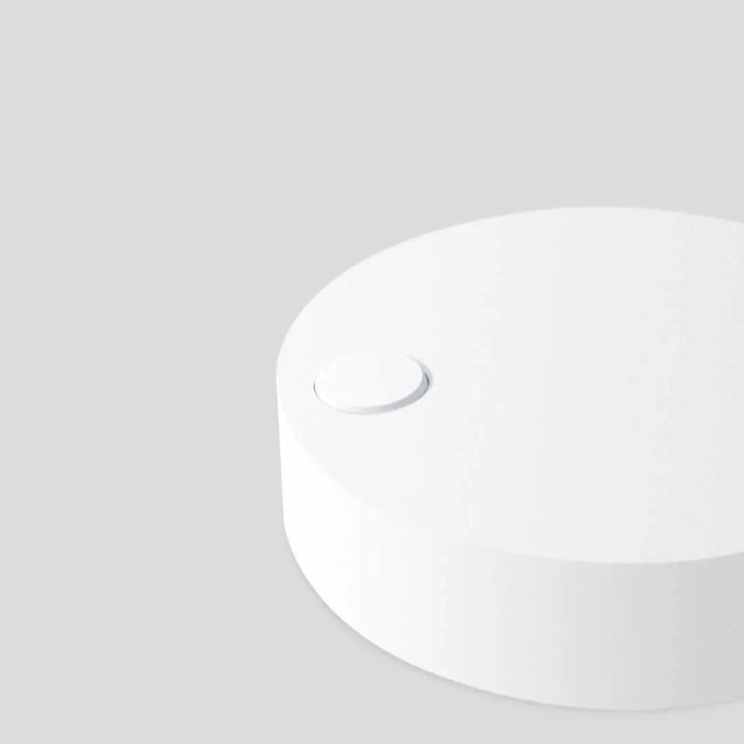 Compact white selfie fill light for mobile phones with three-level dimming switch and USB charging port.