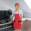 Red Christmas apron with 'Merry Christmas' text for adults and children in kitchen setting