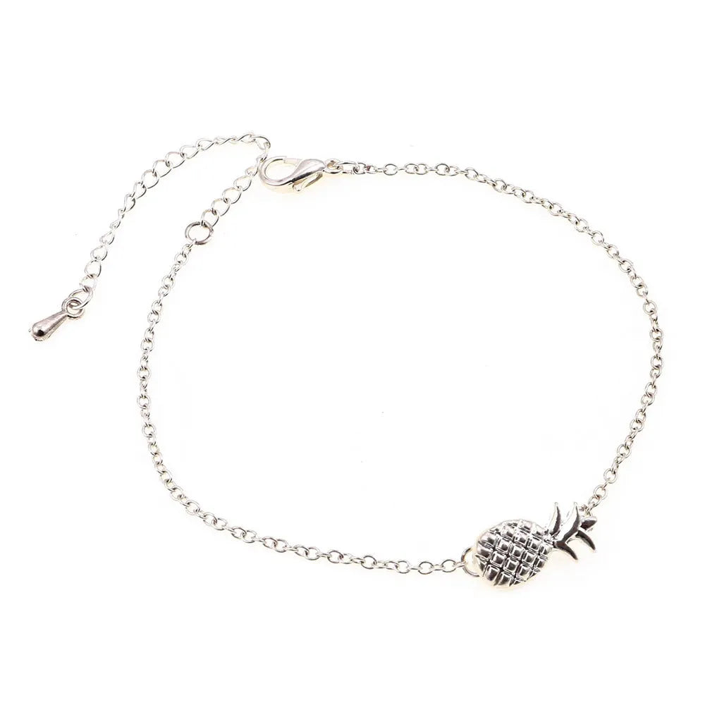 Close-up of a women's alloy bracelet featuring a detailed pineapple charm in gold or silver colour.