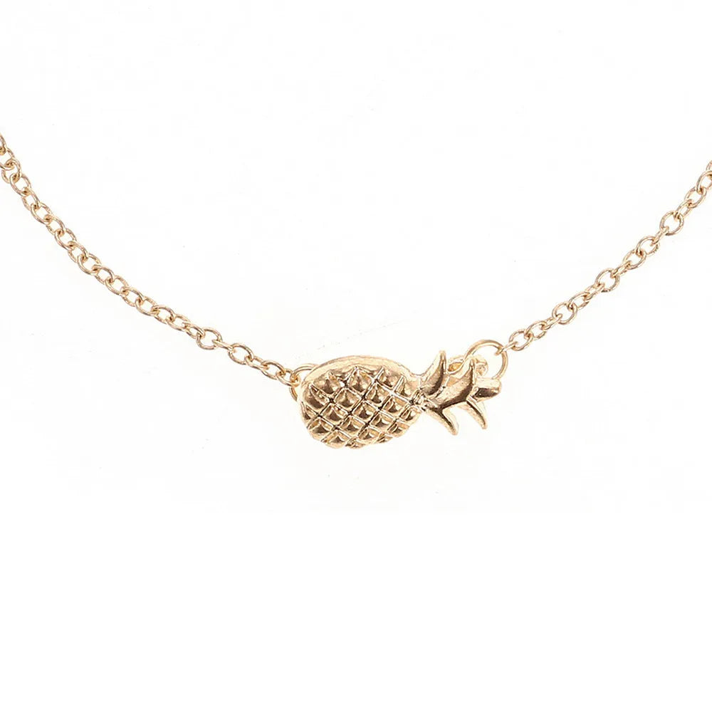 Close-up of a women's alloy bracelet featuring a detailed pineapple charm in gold or silver colour.