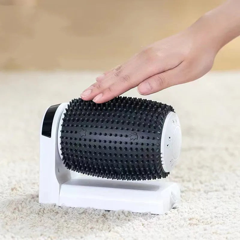 White automatic cat self-groomer brush mounted in a wall corner with soft silicone bristles.