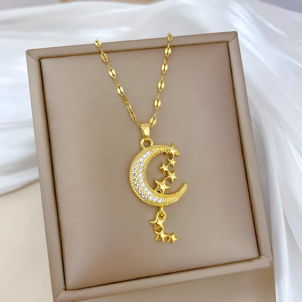 Geometric moon tassel necklace with diamond detail on a stainless steel chain.