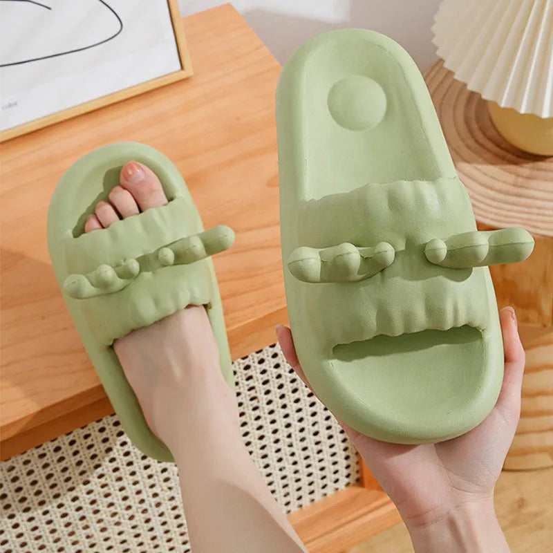 Deer horn design EVA flip flop slippers in light yellow on a white background.