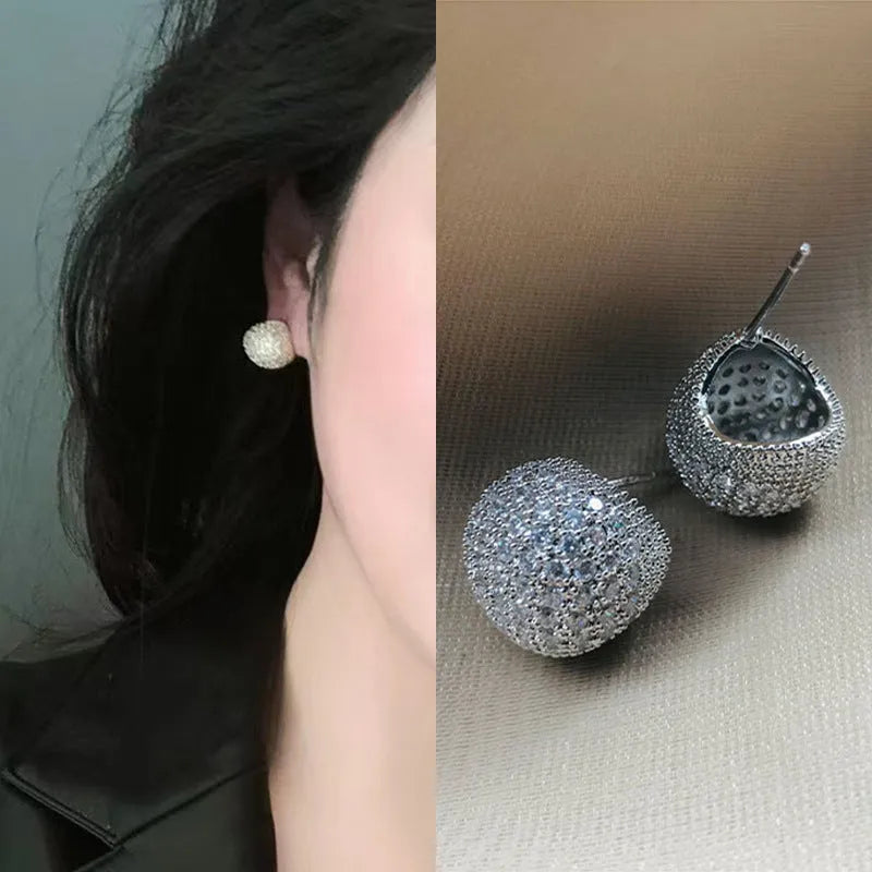 Golden bean earrings with diamond-cut detailing and ear clip fastening in drop shape