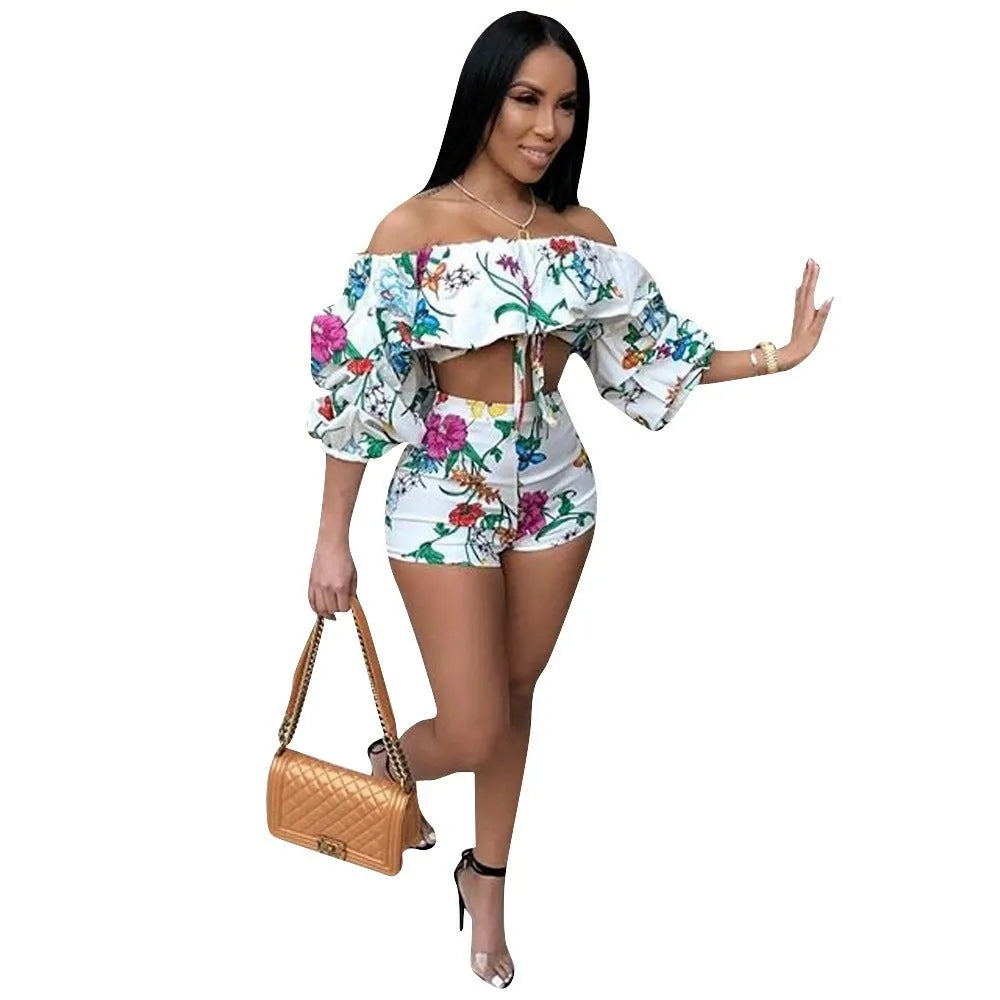 Women's multicolour printed tracksuit set with fleece sleeves on the top and matching shorts.