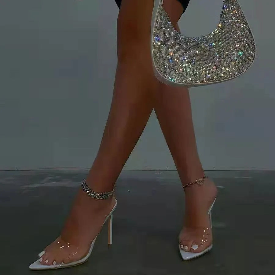 Women's ultra-high vamp stiletto heel slipper in a pointed-toe design.