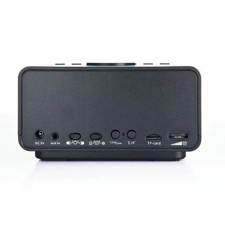 Black and white wireless Bluetooth alarm clock speaker with digital display, showing radio and call functions.