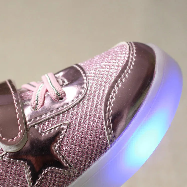 LED magic button sneakers in golden, pink, and silvery metallic finishes with illuminated soles