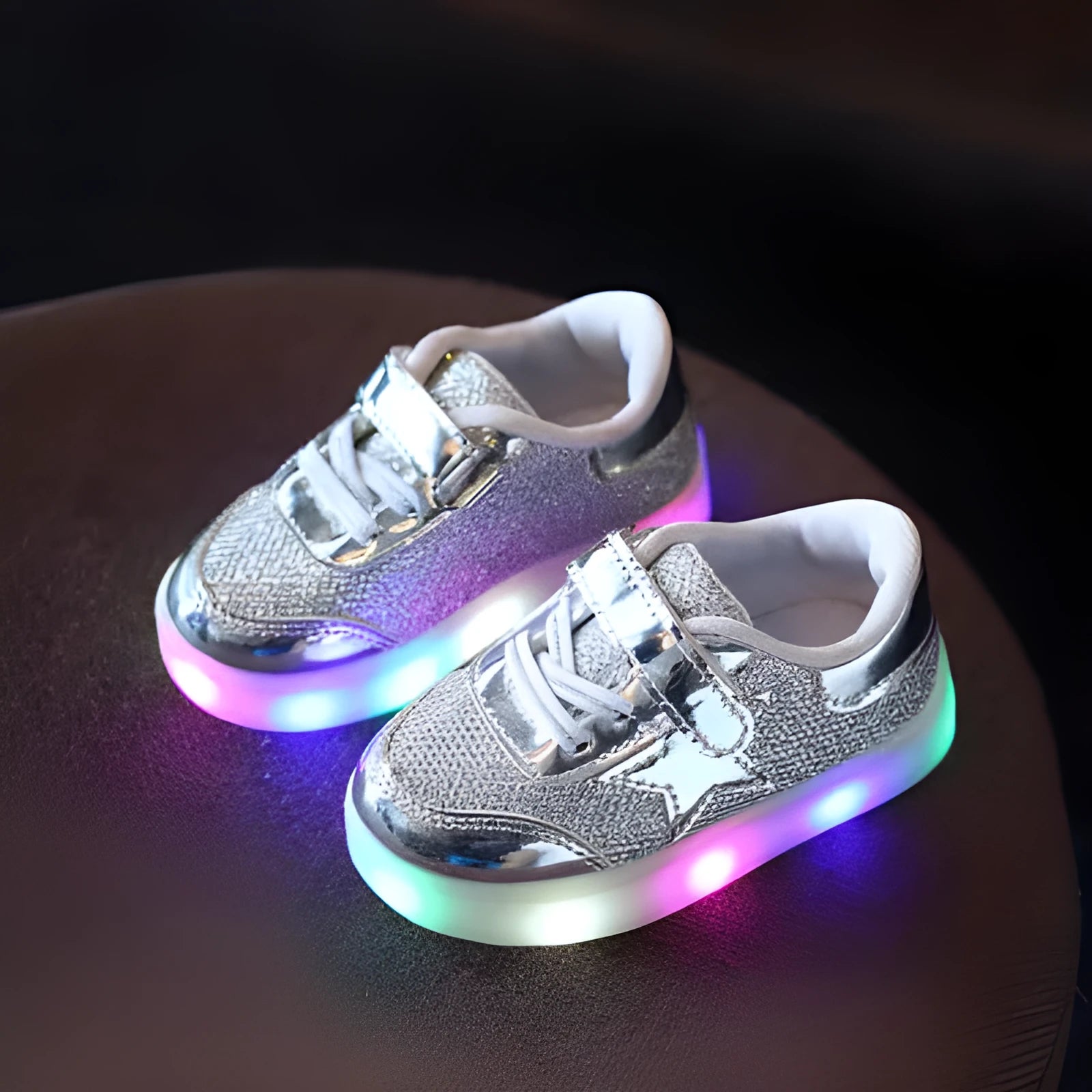 LED magic button sneakers in golden, pink, and silvery metallic finishes with illuminated soles