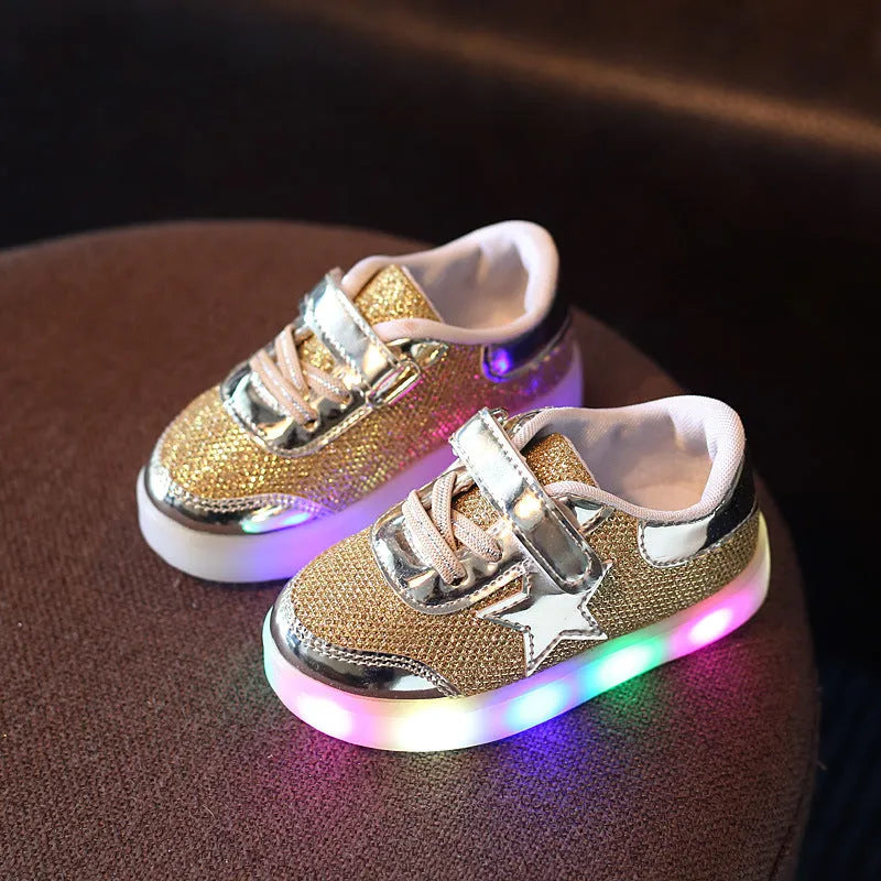 LED magic button sneakers in golden, pink, and silvery metallic finishes with illuminated soles