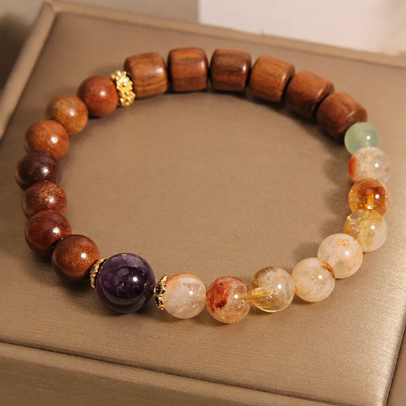 Women's crystal bracelet with yellow tower crystal and ebony amethyst beads featuring pearl accents