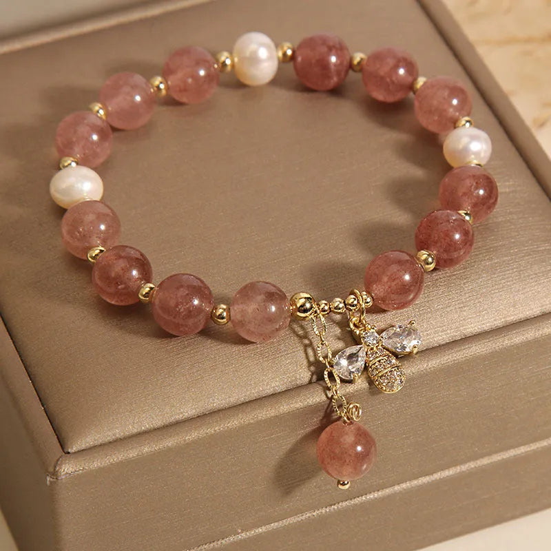 Women's alloy bracelet with three strawberry quartz stones, freshwater pearls, and zircon accents.