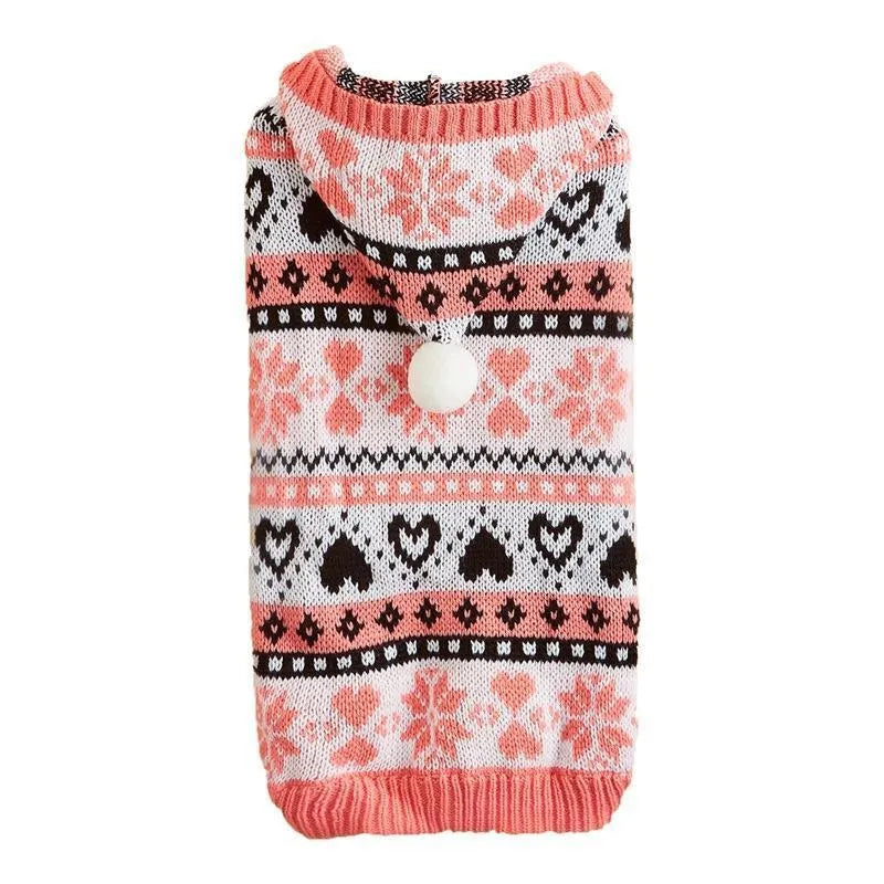 Small pink dog sweater with striped camouflage and snowflake patterns on a mannequin.