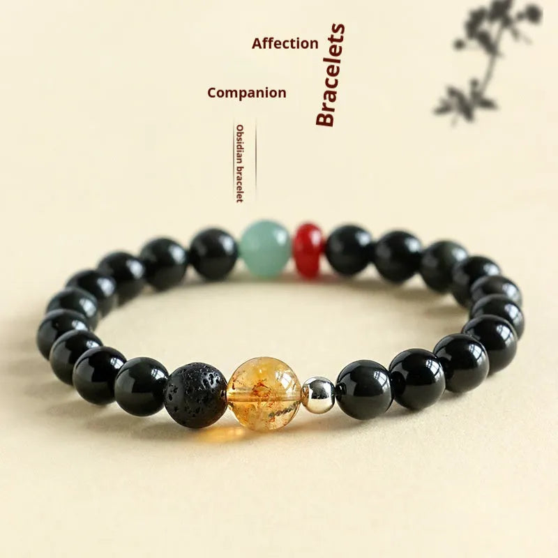 Chinese style obsidian and agate couple bracelet with yellow tower crystal and jade beads.
