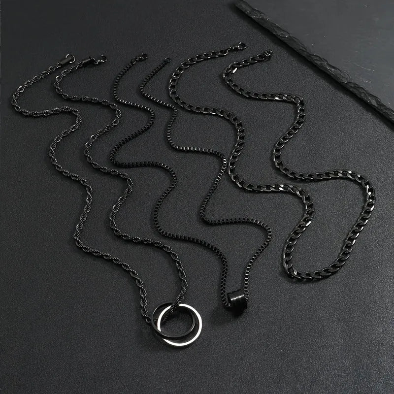 Men's black titanium steel ring buckle necklace set with three matching geometric stainless steel chains.