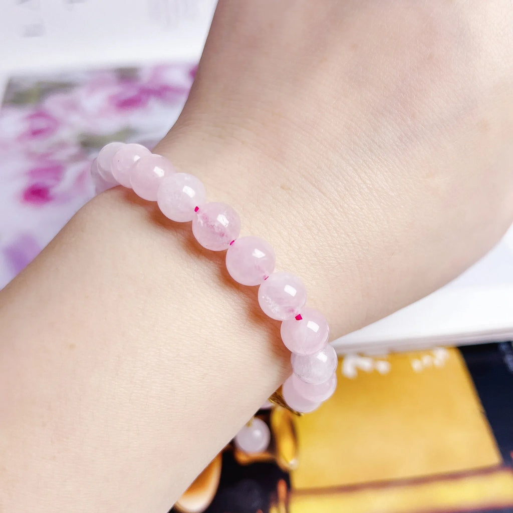 Pink crystal NAFU Peach Blossom bracelet for women on wrist.