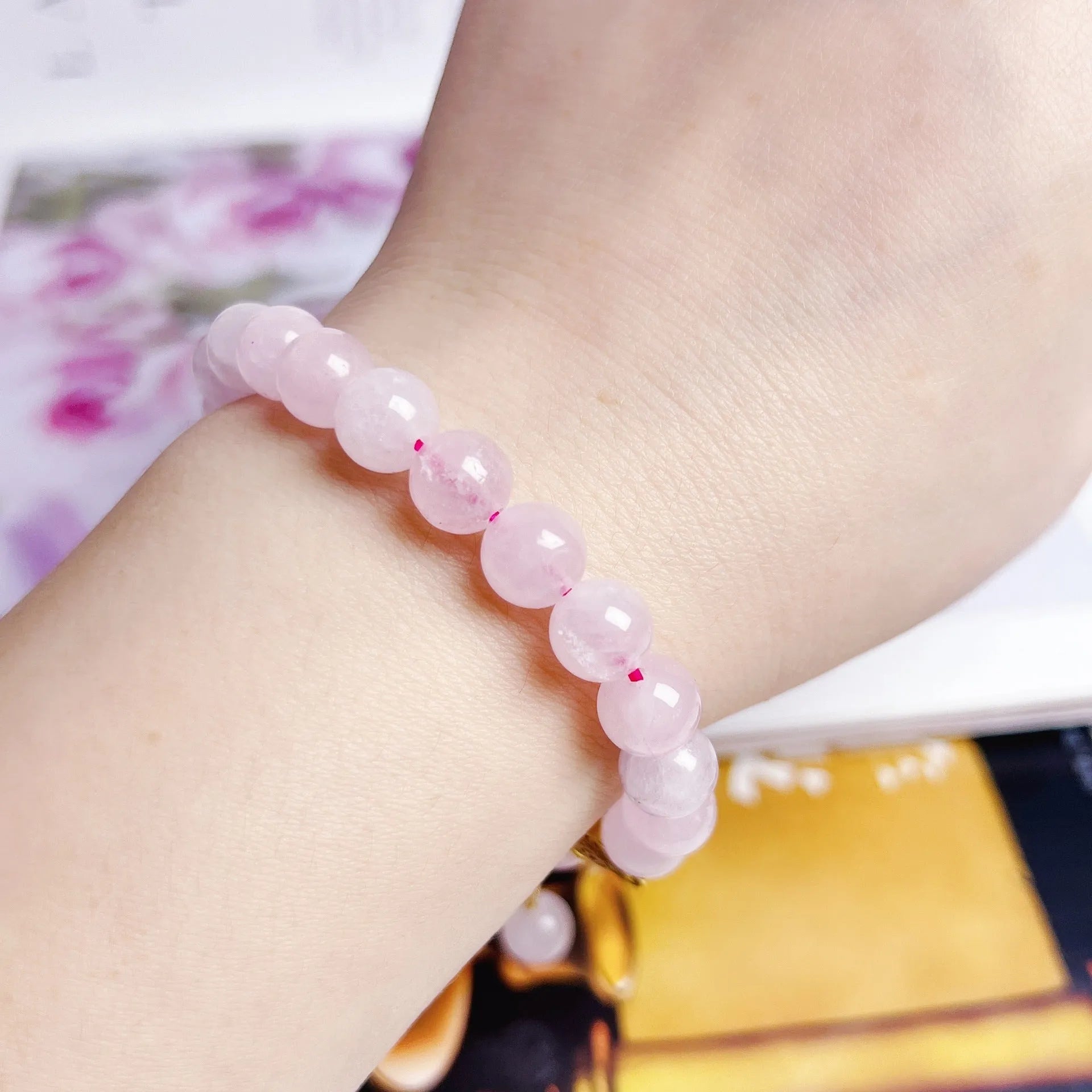 Pink crystal NAFU Peach Blossom bracelet for women on wrist.