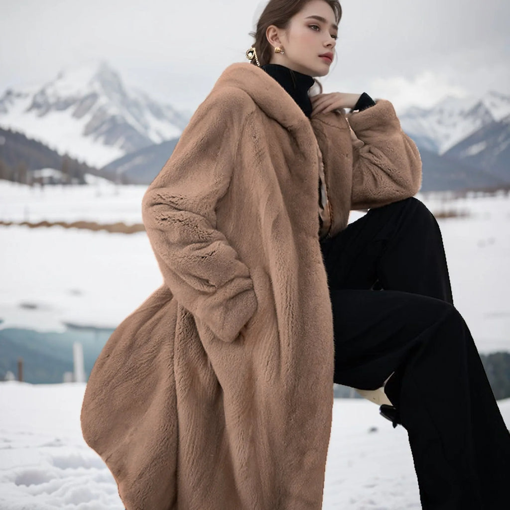 Long brown leopard print faux fur coat on a hanger, showing its loose fit and regular sleeves.