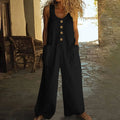 Sleeveless wide leg cotton jumpsuit in art retro style shown in peacock green colour.