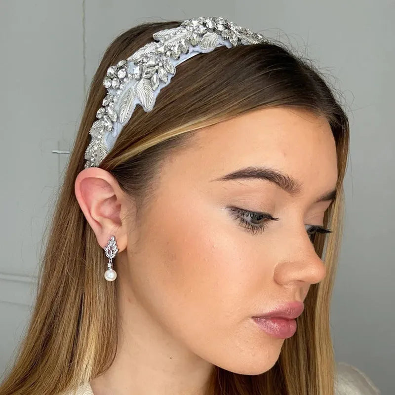 Geometric flower shape stud earrings with micro inlaid zircon stones in gold, rose gold, or white gold plating.