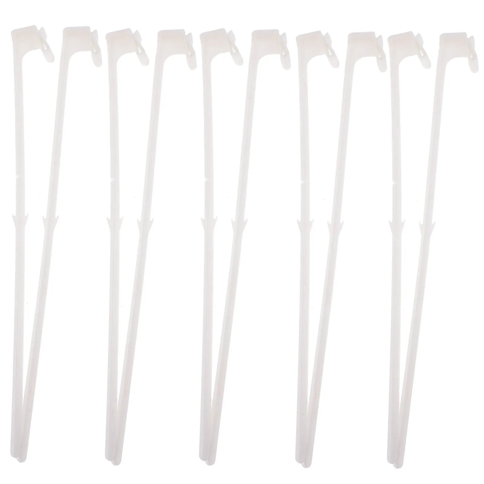 Ten white plastic car window flag pole clip mounts laid out on a surface.