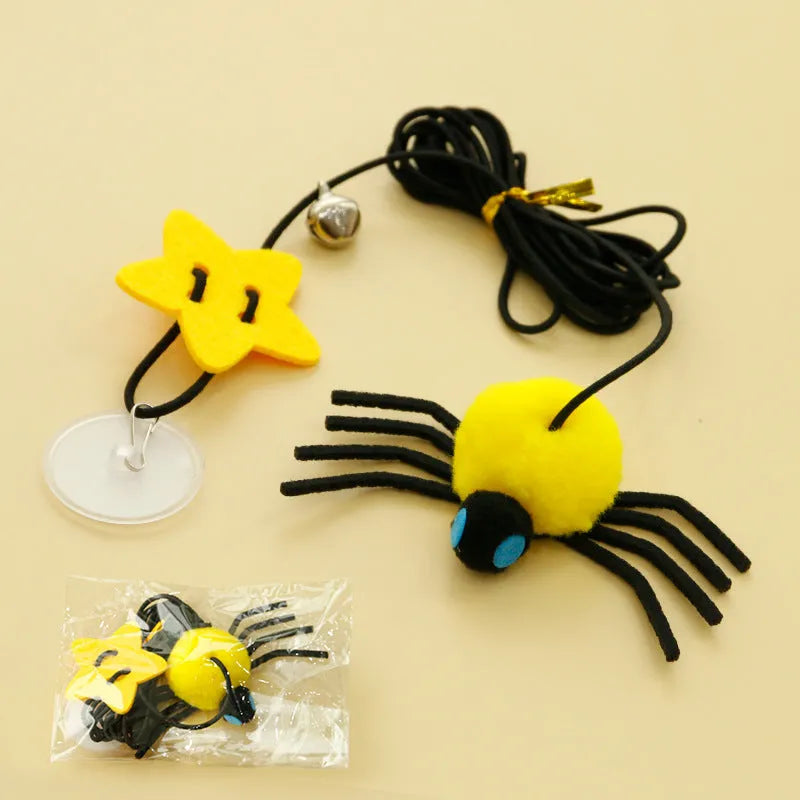 Hanging door cat toy with elastic rope, feather, bell and spider attachments in red or yellow colour