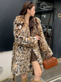 Long faux fur coat with fur collar and pockets in artificial fur fabric