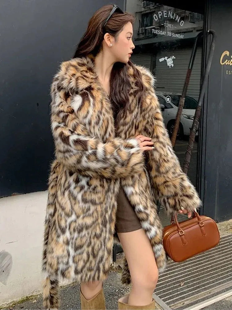 Long faux fur coat with fur collar and pockets in artificial fur fabric