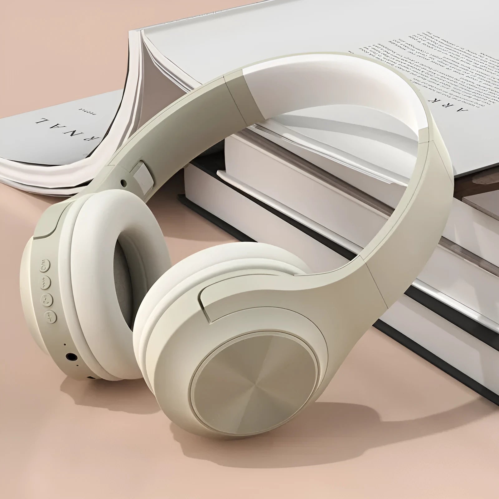 Creative design wireless Bluetooth headset in ivory white colour with a matching charging case.