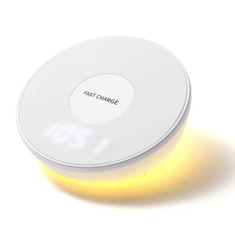 White wireless charging pad with clock display and control buttons for smartphone charging