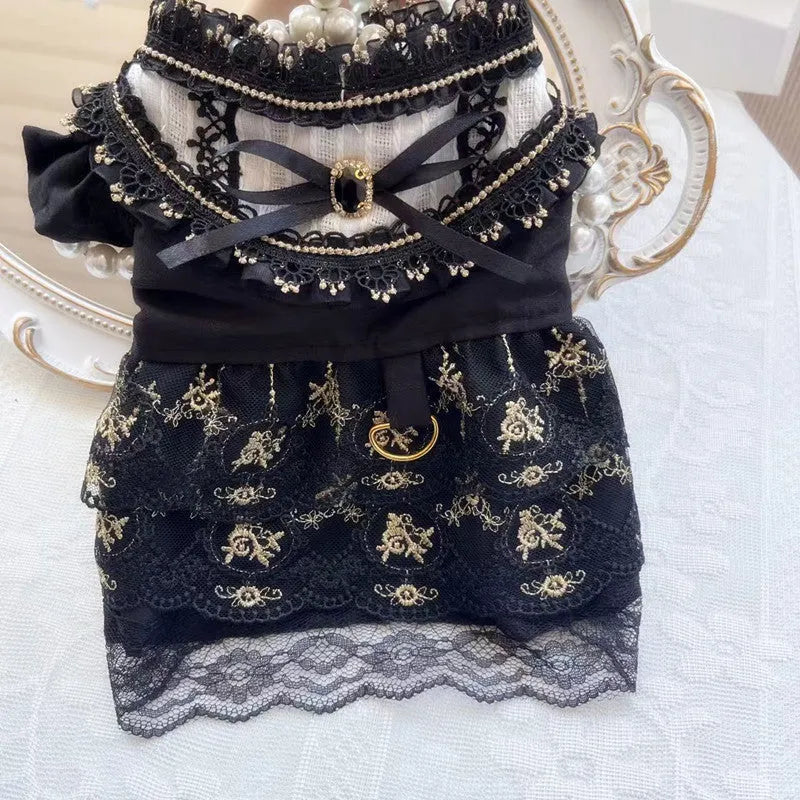 Golden gothic princess style skirt dress for a small dog on a mannequin, showing the skirted design.