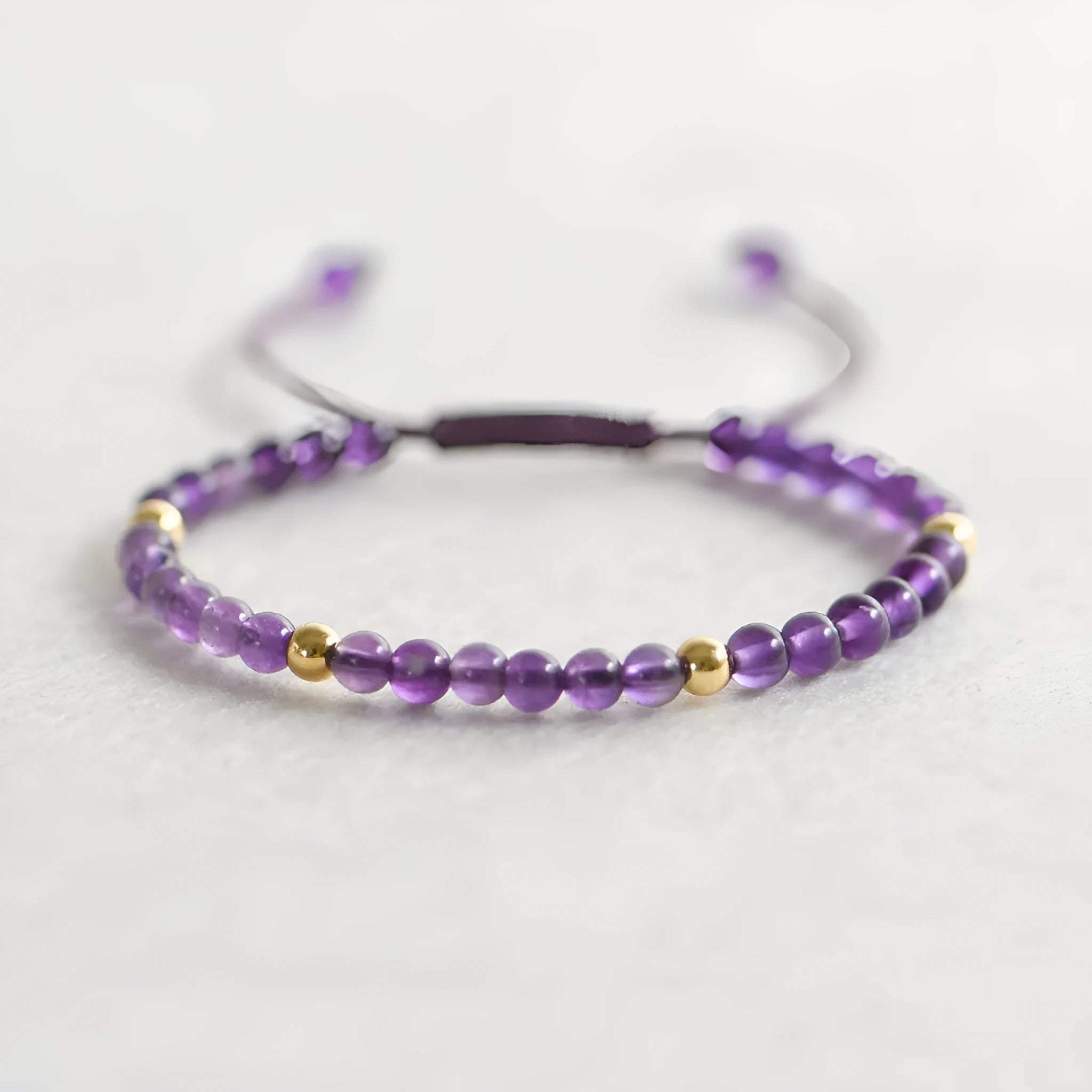 Handmade purple amethyst crystal bracelet with 4mm beads and 14K gold geometric accents