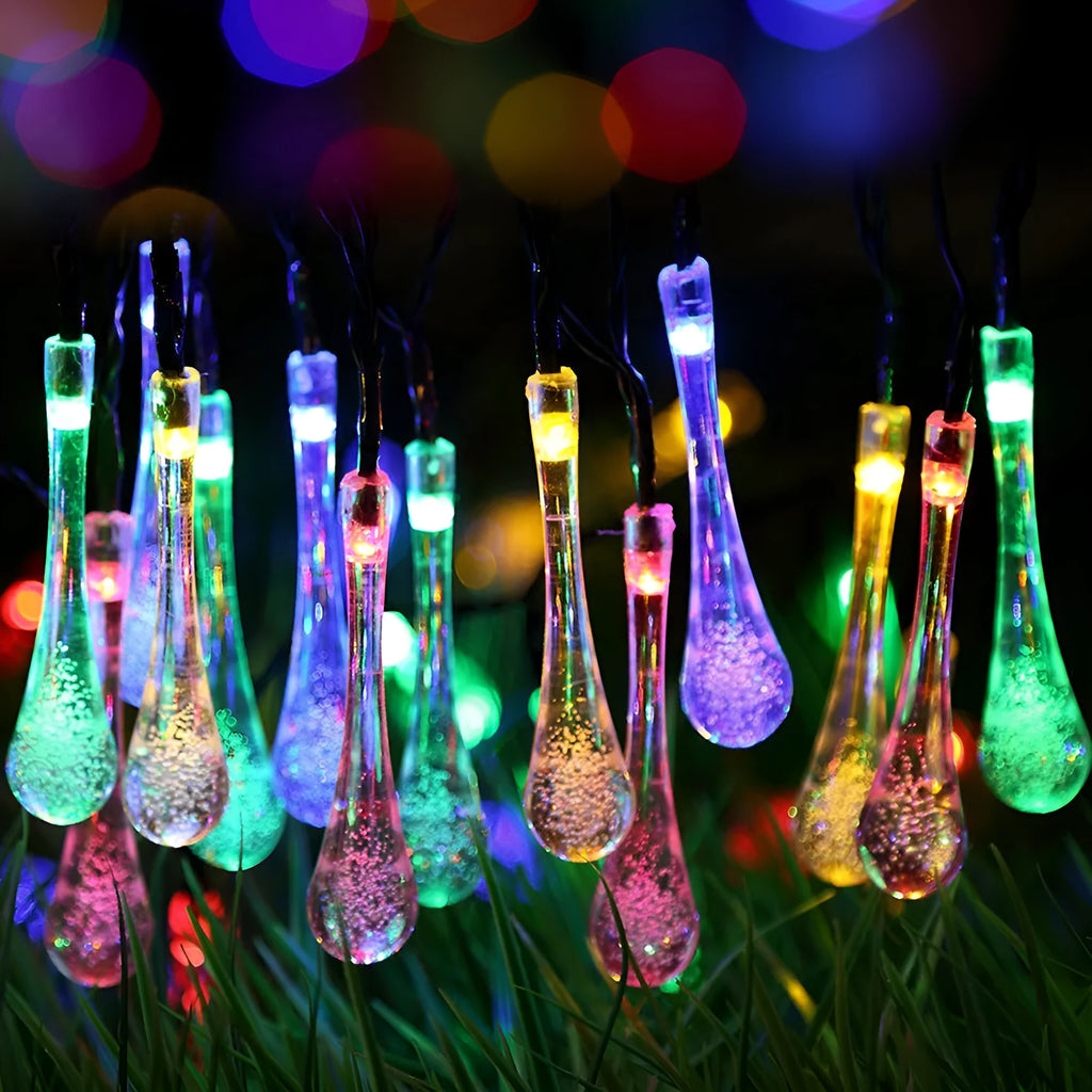 Solar-powered outdoor LED string lights with water drop shaped pendants on a 6.5 metre cable.