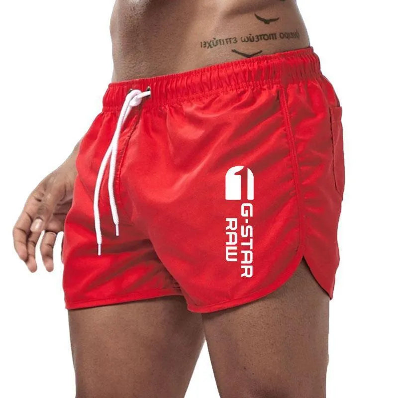 Men's thin hemp-blended polyester sport shorts in multiple colours on a mannequin, showing elastic waistband.