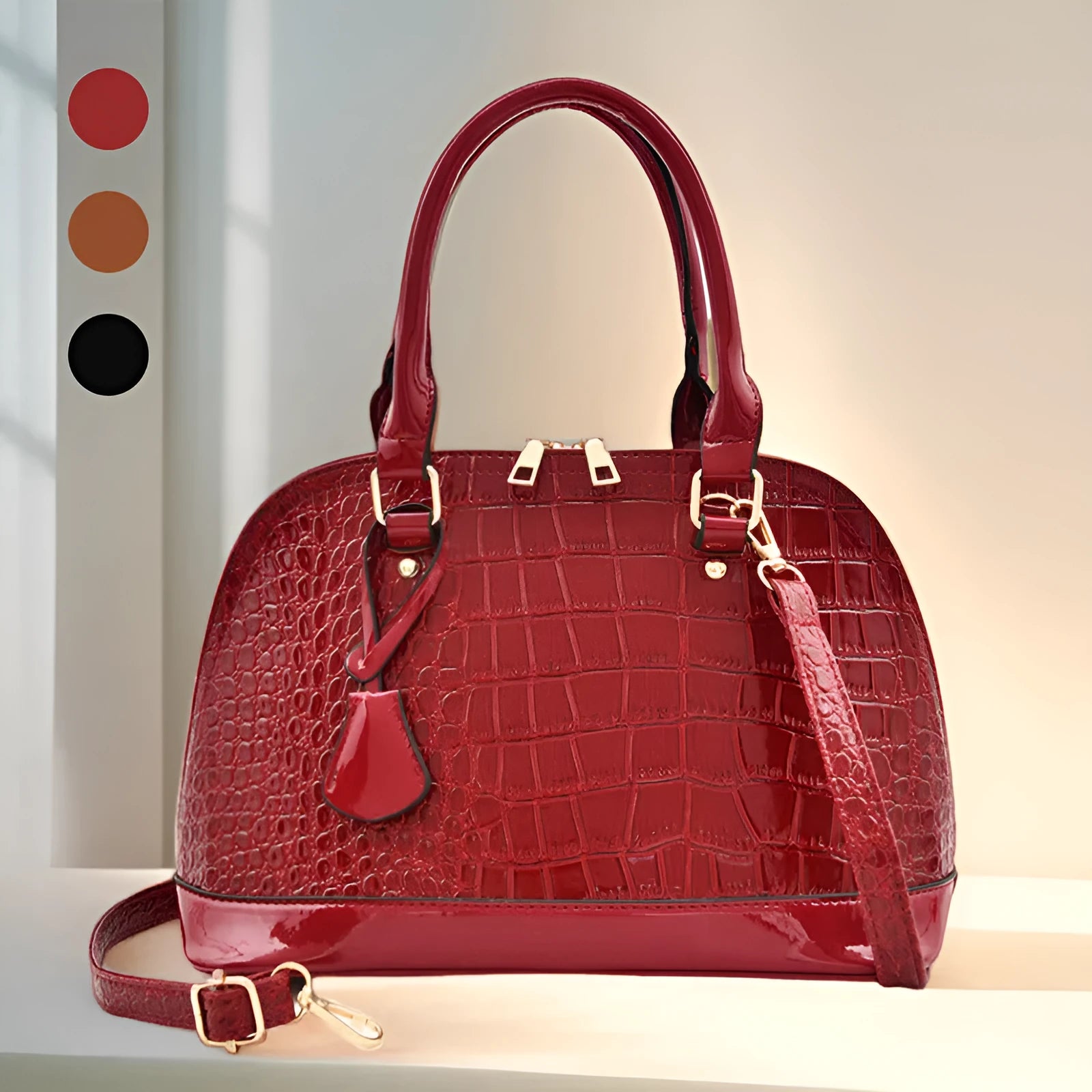 Large shiny black PU leather crossbody bag with shell suitcase shape on a model