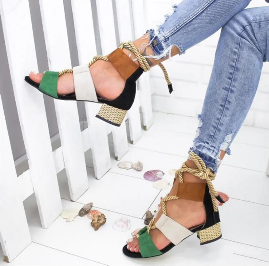 Women's beige suede sandals with thick middle heel, fish mouth toe, and ankle strap.