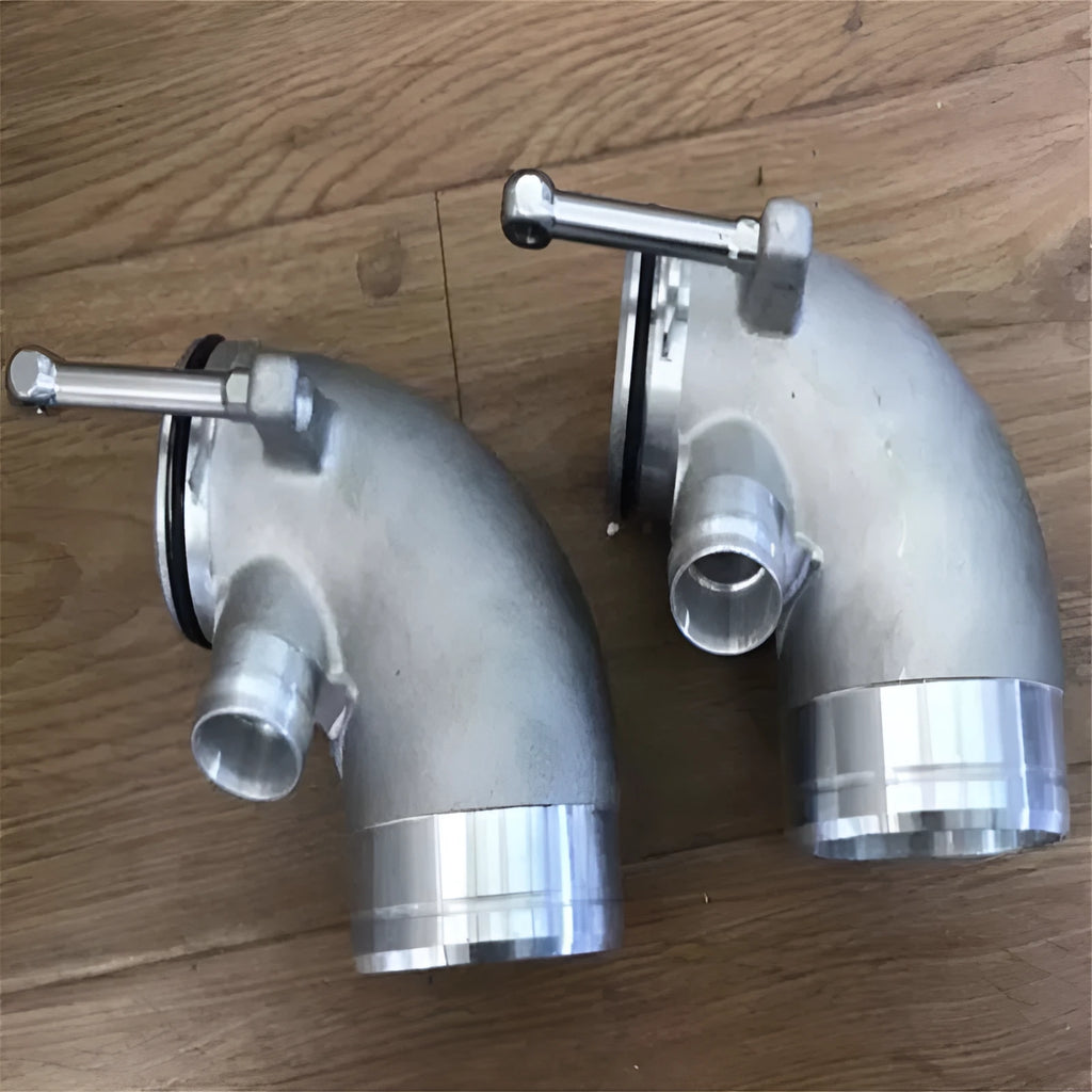 Aluminium alloy 90 degree turbo turbine elbow for lateral engine positioning automotive application