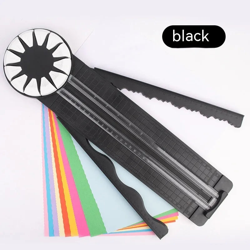 Pink plastic 12-in-1 multifunctional paper cutting machine for crafts on a white background.