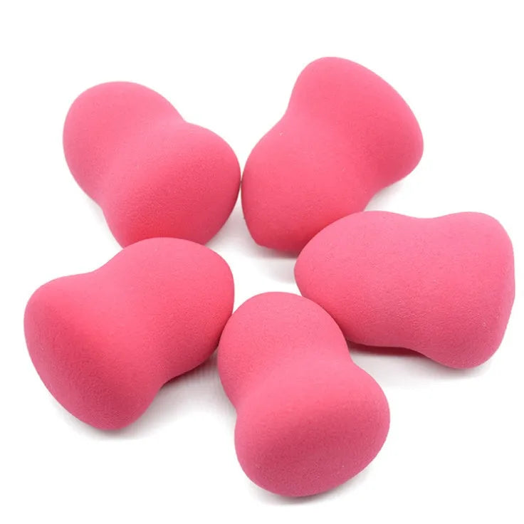 Pink cubic makeup foundation sponge with hydrophilic non-latex material for wet and dry use.