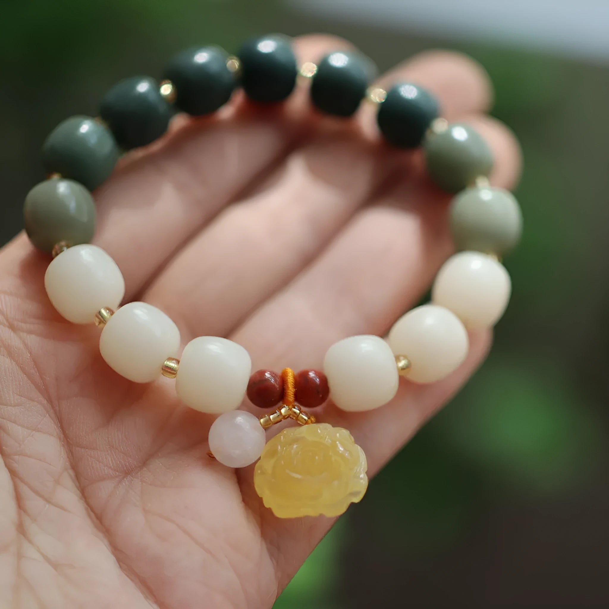 Women's handwoven bracelet with gradient White Jade beads and beeswax Lotus pendant on Bodhi root