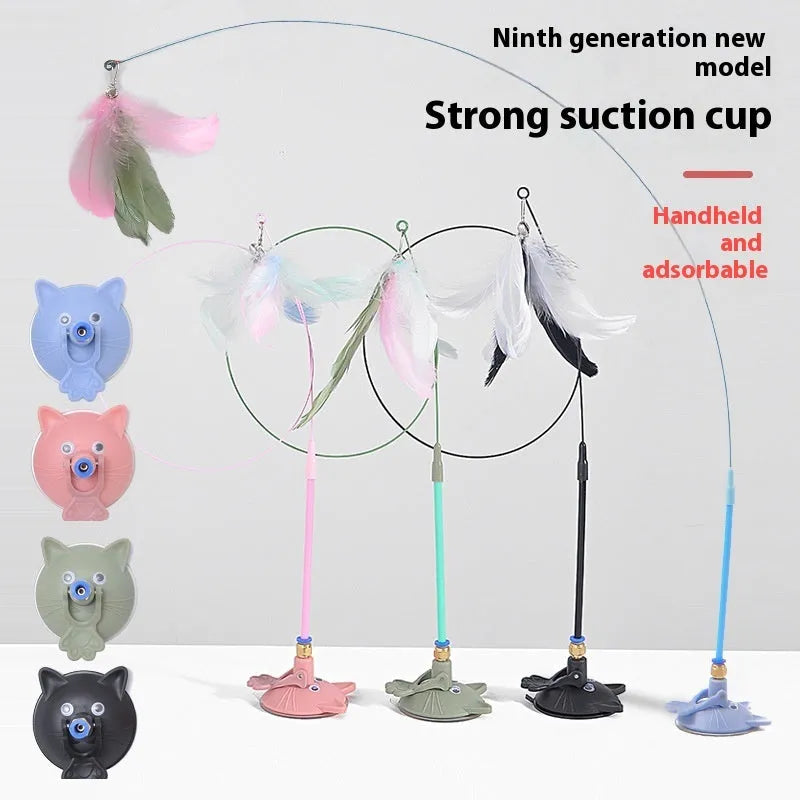 Interactive cat teaser toy with suction cup base, long handle, and dangling brush with bell attachment