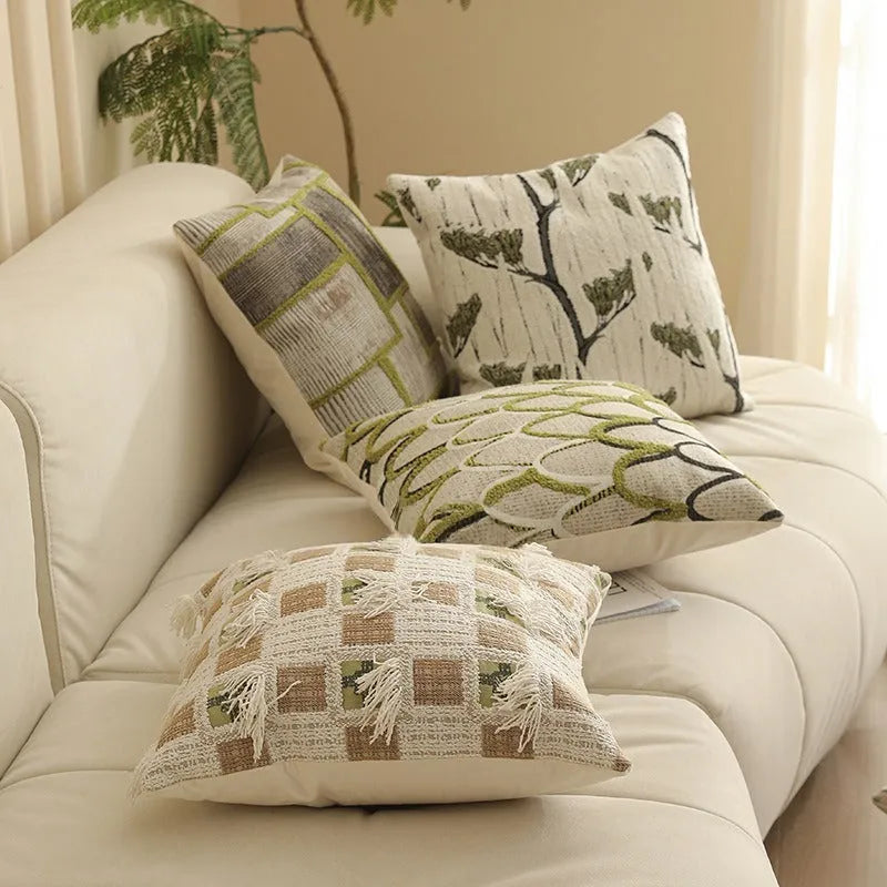 Close-up of a square Jacquard woven cushion cover with a detailed retro floral pattern in various colours.