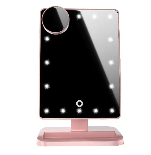 Pink touch screen makeup mirror with ring of LED lights, Bluetooth speaker, and a 10x magnifying section.